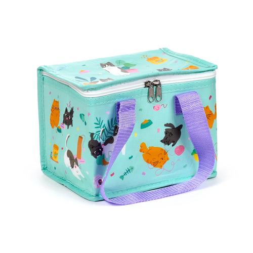 Angled view of a mint green cool bag featuring a playful pattern of cartoon cats and cat-themed items. It has two purple woven handles and a white zipper with dual metallic pull tabs on the top.