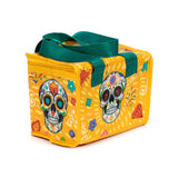 Angled view of a yellow Day of the Dead cool bag, featuring colourful sugar skull and floral designs, with green handles and a yellow zip.