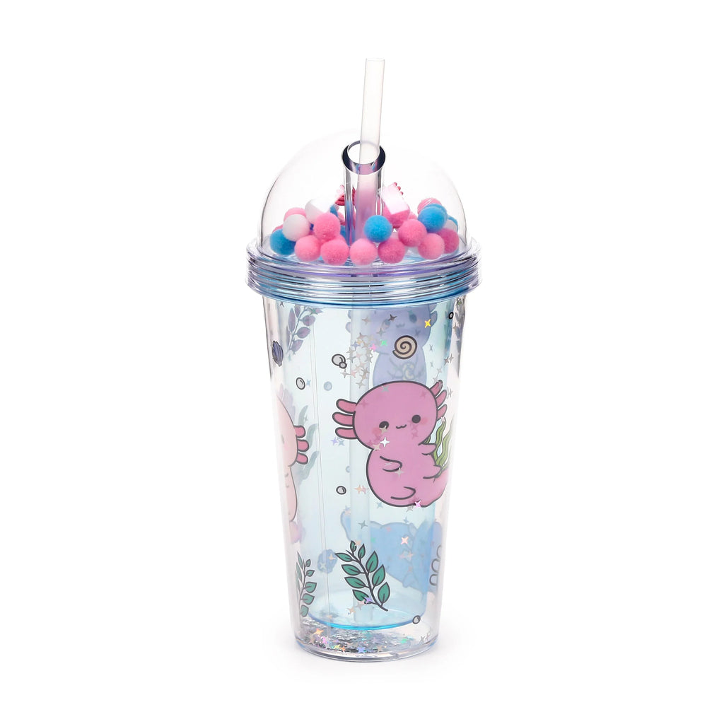 Double-walled cup with a clear outer casing, decorated with pink axolotl characters, green leafy patterns, and glitter. The cup is topped with a clear dome lid containing pink, blue, and white pom-pom charms, and a clear plastic straw is inserted.