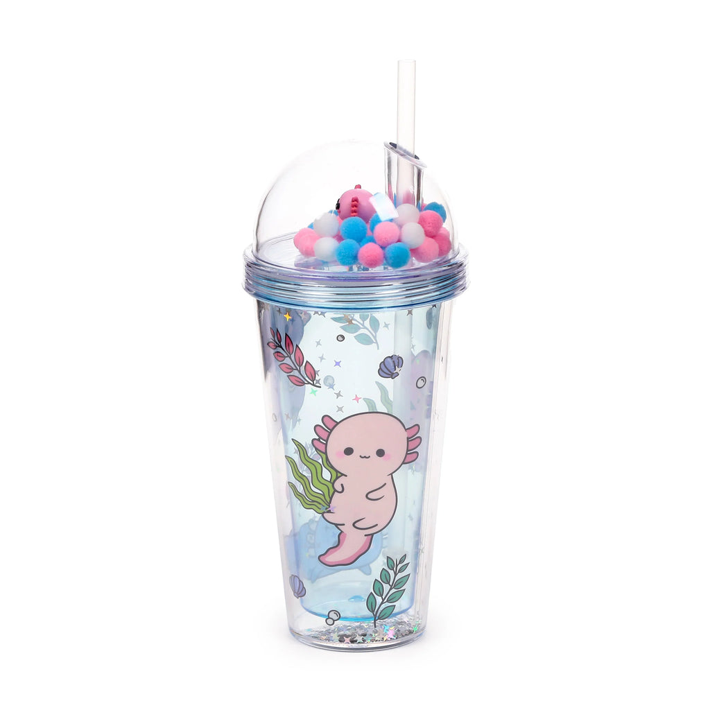 Angled view of a clear double-walled cup with a clear straw and a dome lid containing white, pink, and blue pom-poms with a pink axolotl charm. The cup features a cute pink axolotl illustration, seaweed, shells, and silver glitter with star confetti at the base.