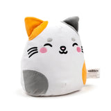 Angled view of a Squidglys cat plush toy, white with orange and grey patches, featuring an embroidered smiling face and a product label.