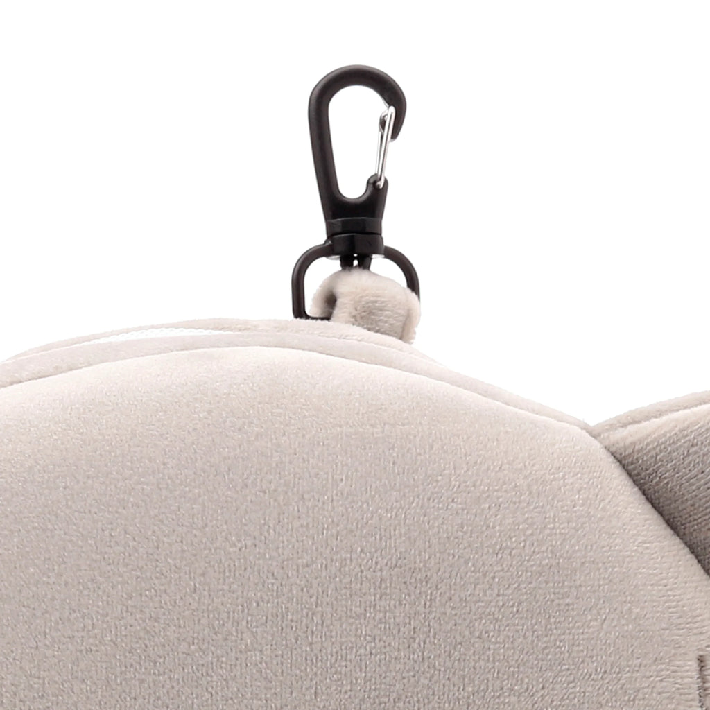 Close-up of the light grey plush travel pillow fabric, featuring a black carabiner clip with a metallic latch for attachment.