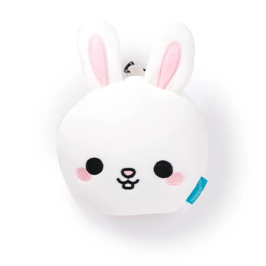 Front view of a white plush rabbit travel pillow and eye mask, featuring pink inner ears and an embroidered facial design.