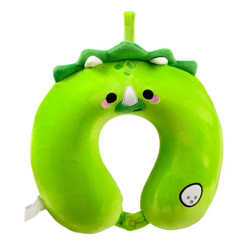 Front view of a bright green dinosaur memory foam travel pillow, featuring a character face with a white snout, black eyes, and pink cheeks. The U-shaped neck pillow has a decorative green frill along the top and a connecting popper at the base.