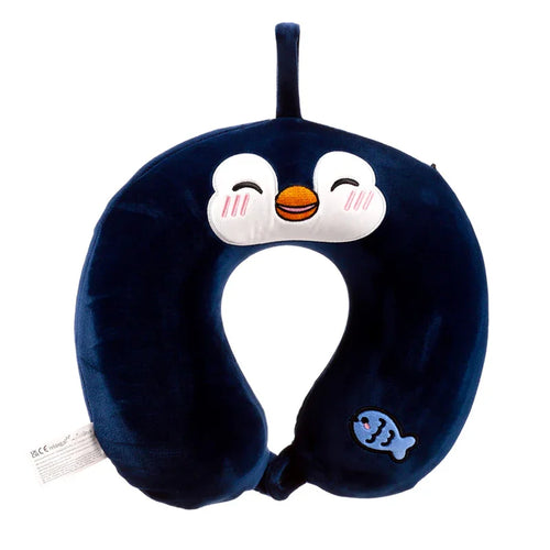 Front view of a dark blue plush memory foam travel pillow shaped like a penguin, featuring an embroidered face with white cheeks, black eyes, an orange beak, and a small light blue fish appliqué.