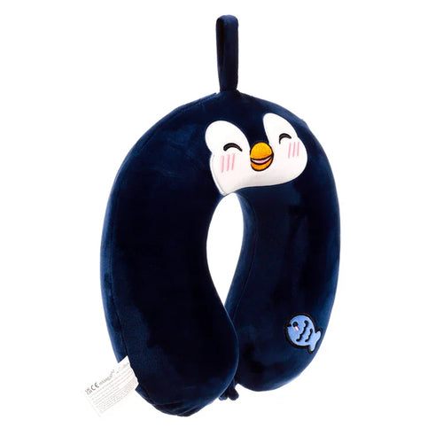 Front view of a dark blue plush memory foam penguin travel pillow, featuring an embroidered face, a small blue fish detail, and a hanging loop.