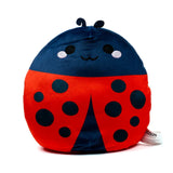 Front view of a plush ladybird toy with a dark blue head and a red body with black spots, featuring an embroidered smiling face with black eyes and white reflections, and two small antennae.
