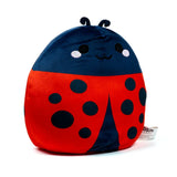 Front view of a ladybug plush toy featuring a dark blue head with embroidered facial features and antennae, and a red body with black spots.