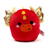 Front view of a red Squidglys dragon plush toy, showcasing shiny gold wings, cream horns, yellow head markings, and embroidered facial features including an orange snout, black eyes, and a black smile, against a white background.