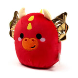 Front view of a red Squidglys dragon plush toy, featuring metallic gold wings, cream horns, yellow head spots, an orange snout with an embroidered smile, black eyes, and pink blush marks, on a white background.