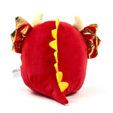 Adoramagic Roscoe the Dragon plush toy from behind, with red fabric, shiny golden wings, yellow dorsal spikes, and cream horns.