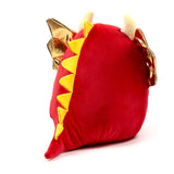 Angled view of a plush red dragon toy, featuring yellow triangular spines along its side, shimmering gold wings, and light-coloured horns.