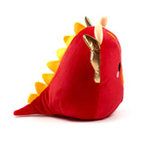 Red Squidglys Adoramagic Roscoe Dragon plush toy, angled view showing its soft red body, yellow back spikes, golden wings, and a black eye with a white mark.