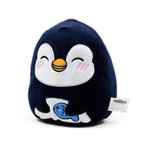 Front view of a dark blue plush penguin toy with a smiling face, holding a light blue fish.