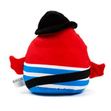 Plush toy with a red upper body and blue, white, and black striped lower body, wearing a black hat. Small red wing-like details protrude from the sides, and a white fabric tag hangs from the left.