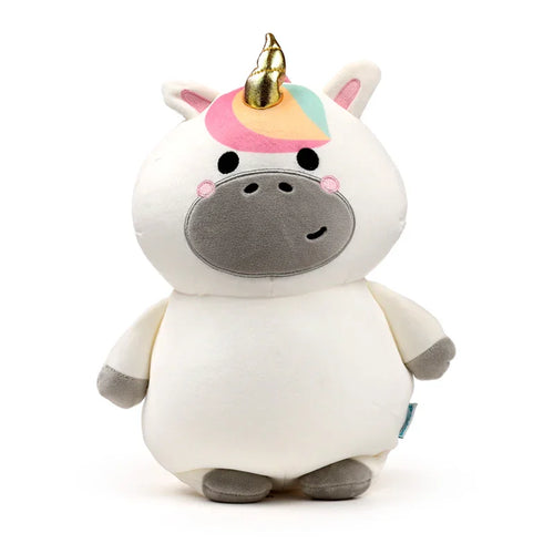 Front view of a white plush unicorn travel pillow with grey arms and feet. It features a golden horn, a colourful fringe in pink, orange, light blue, and green, black eyes, and pink rosy cheeks above a grey snout.