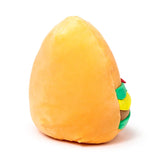 Angled plush burger toy with soft orange bun and colourful red, green, yellow, and brown layers peeking from the side.
