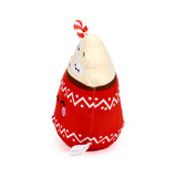 Angled view of a red hot chocolate plush toy with a cute embroidered face, white zigzag patterns, a cream-coloured top with marshmallow faces, and a red and white striped candy cane.
