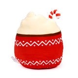 Front view of an Aspen the Hot Chocolate plush toy, featuring a red cup base with white zigzag and dot patterns, topped with cream-coloured whipped cream and a red and white striped candy cane.