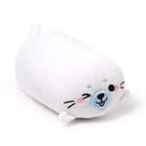 Angled view of a white seal plush toy, showing its embroidered face with a light blue nose, pink cheeks, and black whiskers.