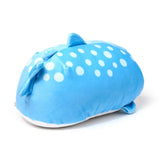 Angled view of a light blue whale shark plush toy featuring white polka dots, a dorsal fin, and a tail fin, with a white underside.