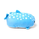 Angled view of a blue whale shark plush toy with white polka dots, black eyes, and pink cheeks, showing its dorsal, tail, and side fins.