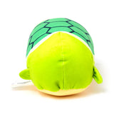 Green plush turtle toy, overhead view displaying its dark green hexagonal shell pattern and lime green body with small flippers.