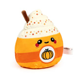 Front view of an orange plush spiced latte toy with a smiling face, cream whipped topping, colourful sprinkles, and a pumpkin illustration.