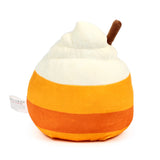 Angled view of Hazel the Spiced Latte plush toy, featuring a cream-coloured whipped topping with a brown stick, and an orange and dark orange striped body.