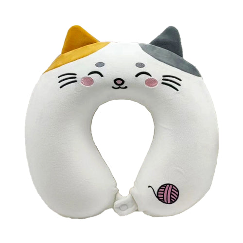 Front view of a white plush memory foam travel pillow designed as a cat, featuring an embroidered smiling face, one yellow and one grey ear, and a pink yarn ball detail.
