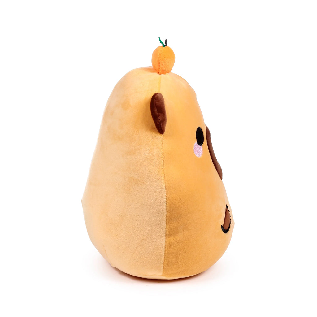 Side profile of Duke the Capybara plush toy, a two-toned brown design with embroidered eyes, nose, pink blush, and an orange fruit on its head.