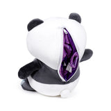 Back view of a black and white panda plush toy with a partially open white zip, revealing purple fabric from the travel pillow inside.