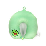 A light green avocado plush travel pillow, featuring an embroidered avocado face, a central pit detail, a top hanging loop, and a snap closure, shown from an overhead perspective on a white background.