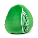 Green avocado plush toy and travel pillow with a partially open white zip showing the lighter green fabric inside.