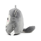 Angled view of a grey wolf plush toy, showing its rounded body, a prominent ear, and a trailing tail. A partial view of its face reveals a white snout and pink nose, with a care label visible on its side.