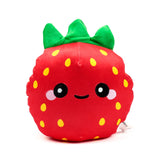 Front view of a red plush strawberry toy, featuring green leaves, yellow seeds, and an embroidered kawaii face with large eyes and pink cheeks.
