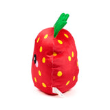 Angled view of a red strawberry plush toy with yellow dots, green leaves, a partially visible black eye, pink cheek, and white product label.