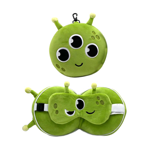 Front view of a compact lime green alien character travel pillow with three eyes and antennae, displayed alongside an angled view of the unfolded U-shaped pillow with a matching alien eye mask and adjustable strap.