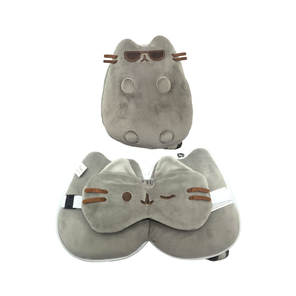 Front view of a grey plush Pusheen the Cat travel pillow and eye mask set, showcasing its two forms: a compact cat plush with sunglasses and an unfolded U-shaped travel pillow with a winking cat-face eye mask.