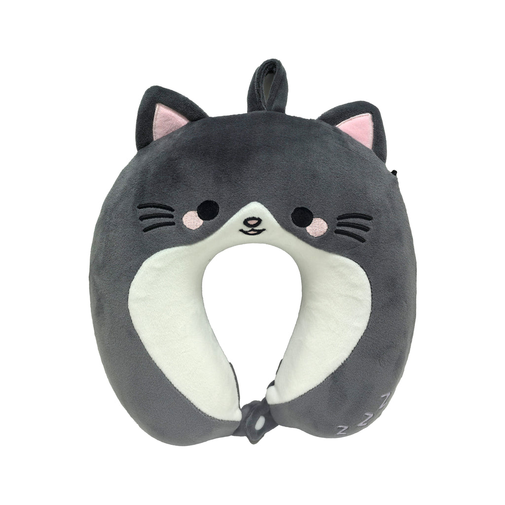 Front view of a dark grey plush kids' memory foam travel pillow designed as a smiling cat, featuring white details on its chest and face, pink inner ears, embroidered black eyes, pink cheeks, and whiskers. The pillow has a loop at the top and a button closure at the base, with 'ZzZ' embroidered on one side.