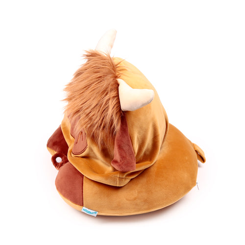 Brown plush Highland Coo travel pillow and hood, angled view, showing its fluffy mane, soft beige horns, and darker brown ears.
