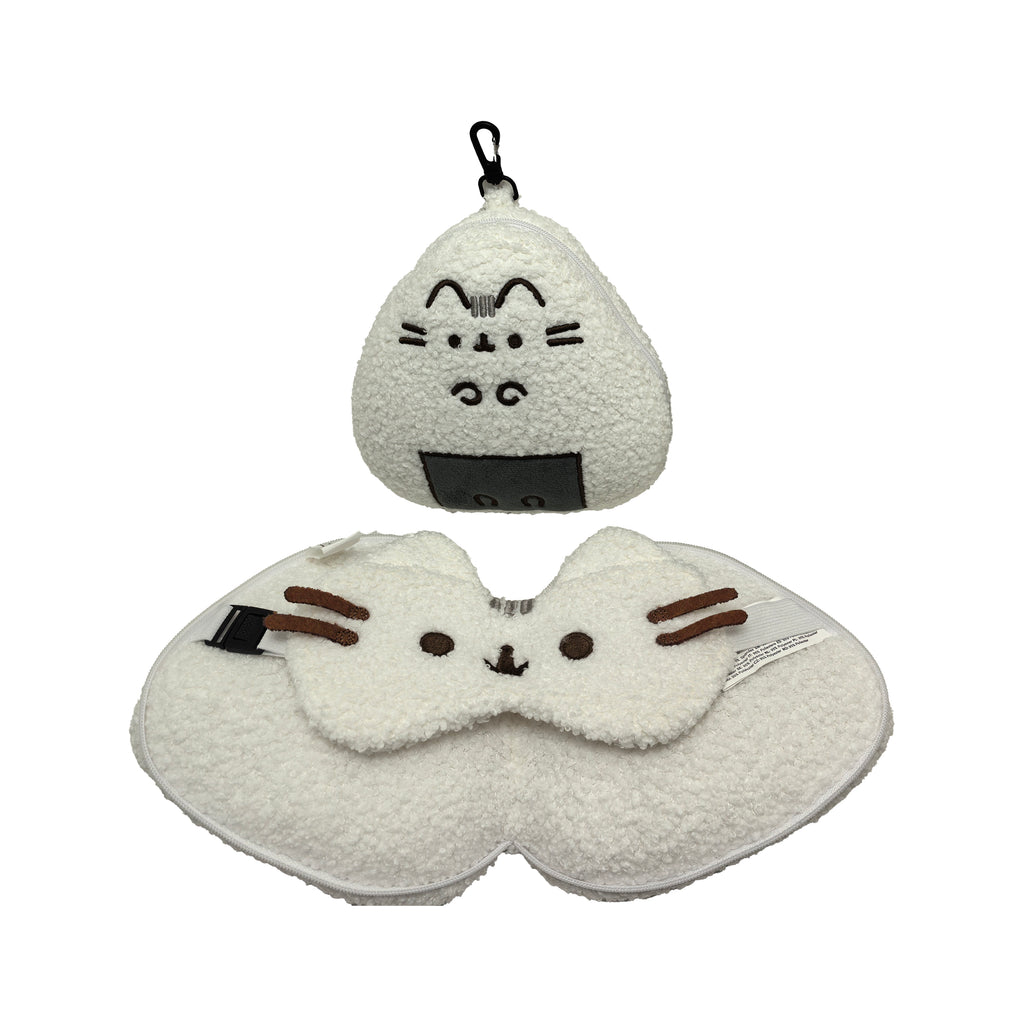 Front view of a white fluffy Pusheen the Cat travel pillow and eye mask set. The U-shaped pillow has embroidered cat facial details, brown whiskers, and a black buckle. Its triangular, onigiri-shaped carry pouch, with an embroidered Pusheen face, dark grey 'nori' base, zip, and black carabiner clip, is placed above it.