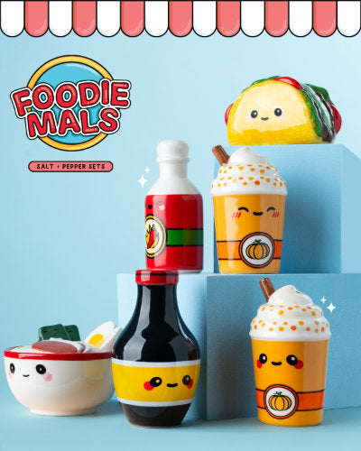 Set of unusual and cute food-themed salt and pepper shakers on  blue tired background and 'Foodiemals' branding.