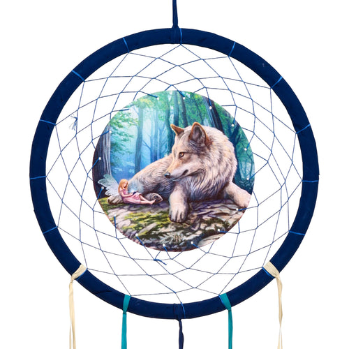 Front view of a dark blue dreamcatcher, featuring a circular illustration of a grey wolf resting beside a small fairy in a forest, with blue netting and hanging ribbons.