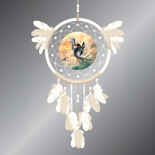 Cream dreamcatcher depicting a central angel illustration, adorned with light-coloured feathers and beads, on a grey background.