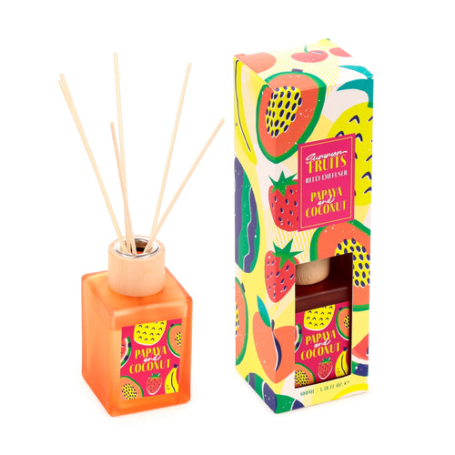Angled view of a Summer Fruits Papaya & Coconut reed diffuser, featuring an orange square bottle with natural reeds, presented alongside its vibrant fruit-patterned packaging box.
