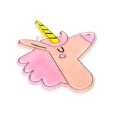 Angled view of a translucent DIY unicorn suncatcher outline with a pink mane, peach face, yellow striped horn, and black colour outlines, against a white background.