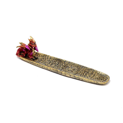 Angled view of an antique gold ashcatcher incense burner featuring a sculpted red and gold dragon head at one end and mystical carved symbols along its length.