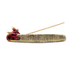 Front view of a gold-toned ashcatcher incense burner featuring an iridescent red and purple dragon figure at one end, with carved mystical symbols along its trough, holding an incense stick, on a white background.
