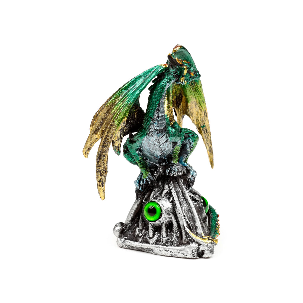 Angled view of a dark green and gold dragon ornament with textured scales and wings, perched on a silver-coloured base featuring emerald green eye details.